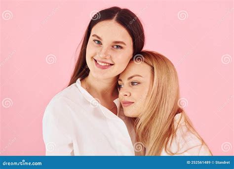 Embracing Each Other Young Mother With Her Daughter Standing In The