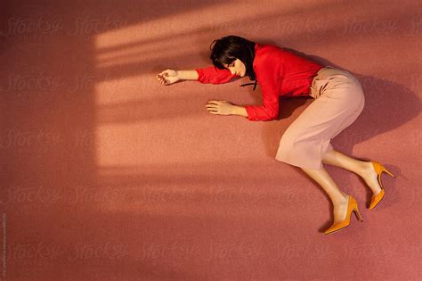 Woman Lying Down On The Floor Of A Room By Ulasandmerve