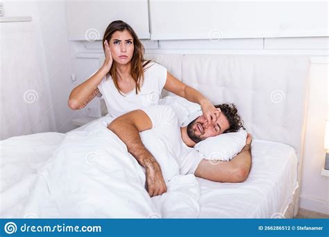 Couple In Bed Man Snoring And Woman Can`t Sleep Snoring Man And Young
