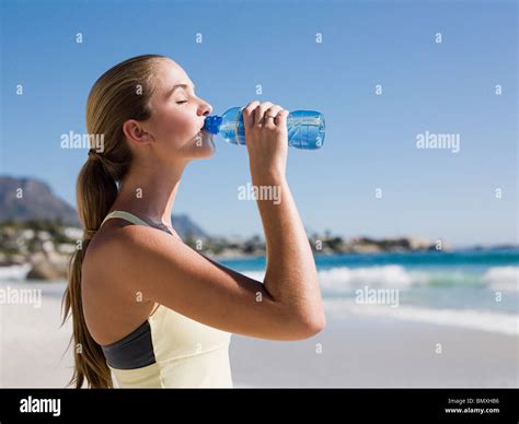 Young Woman Drinking Water Stock Photo Alamy