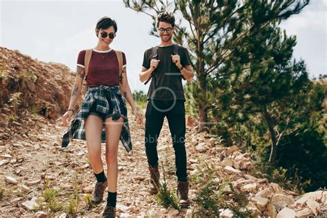 Couple Wearing Backpacks Hiking In The Countryside Jacob Lund Photography Store Premium Stock