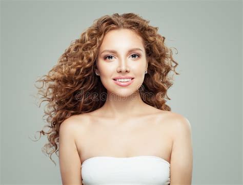 Young Beautiful Woman With Long Healthy Curly Hair Smiling Girl On