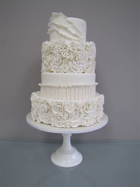 It typically features thin, horizontal lines of buttercream and gives off a rustic look. White Floral Ruffle Wedding Cake - CakeCentral.com