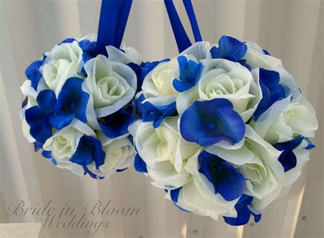 White wedding flowers make the venue look rich and classic. Wedding pomanders White Royal blue Wedding flower balls Flower