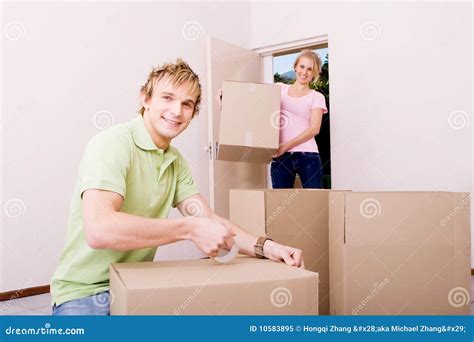 Boyfriend Helping Girlfriend Move In Stock Image Image Of Blonde
