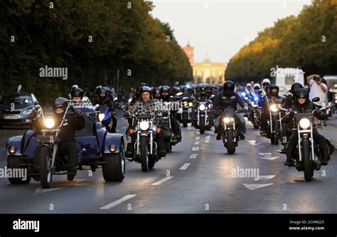 Motorcyclists Drive Down The Street As They Participate In A Hells