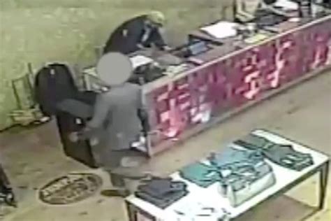 Shocking Cctv Footage Captures Moment Robber Grabs Sales Assistant Around Neck In City Centre