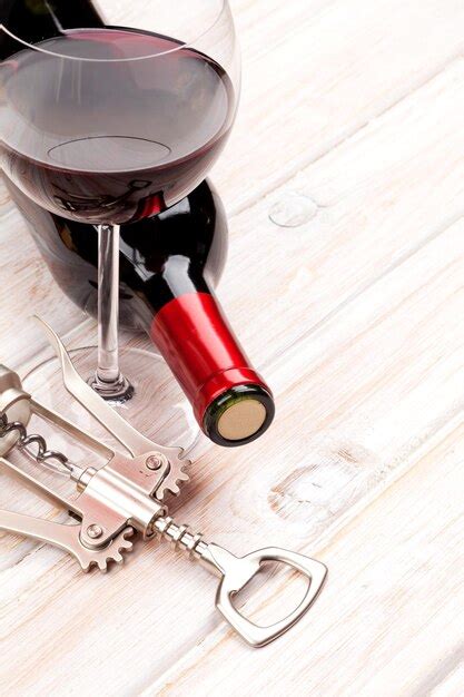 Premium Photo Red Wine Bottle Glass And Corkscrew