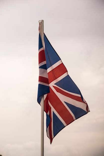 Free Photo Flag Of Britain Under Blue Sky