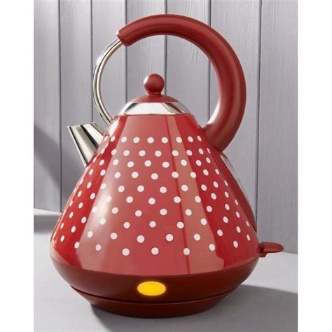 A Red Tea Kettle With White Polka Dots On It