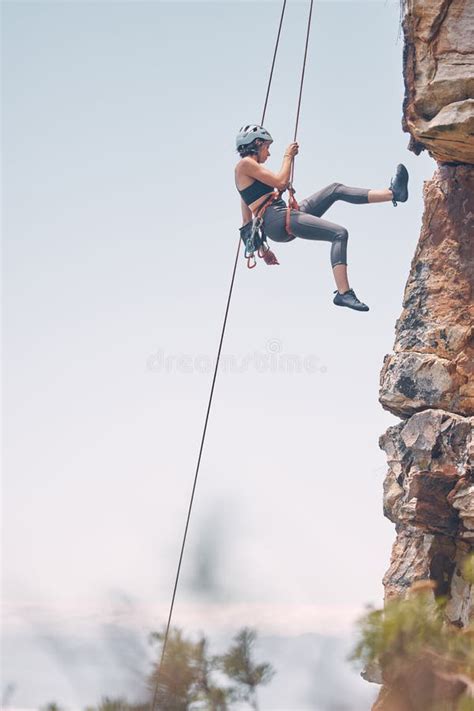 Woman Climbing Mountain With Rope Outdoor Nature Activity And Fitness