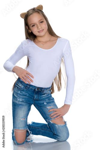 Beautiful Teen Girl In Jeans With Holes Buy This Stock Photo And
