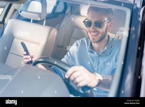 Man With Smartphone Driving Car Stock Photo Alamy