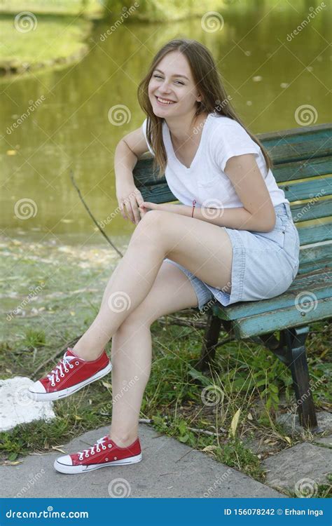 Young Teenage Girl Having Fun In The Park On A Bench Education School Girl Smiling Young