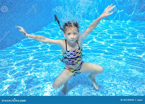 Children Swim Underwater