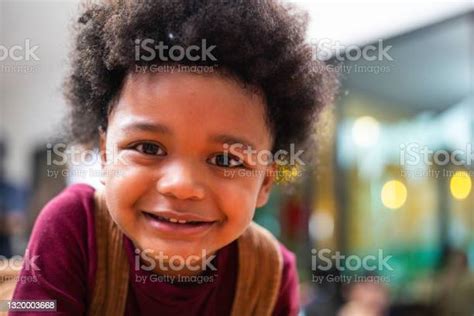 Portrait Of Playful Black Kid Smiling And Making Funny Face African