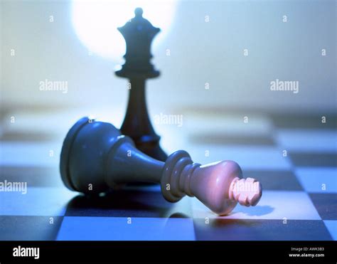 Queen Chess Piece Fallen In Front Of King Chess Piece Stock Photo Alamy