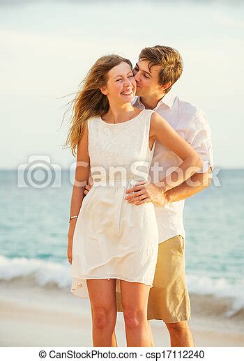 Young Couple In Love On The Beach Sunset Young Couple In Love