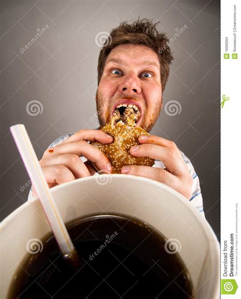 Man eating fast food stock photo. Image of juicy, hunger - 19390584