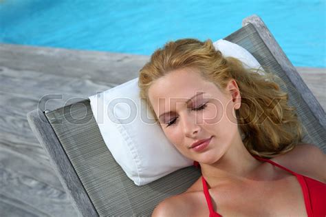 Blond Woman In Red Bikini Relaxing By Stock Image Colourbox