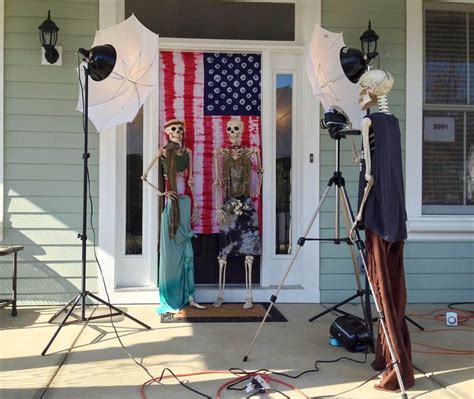 Two Skeletons In Front Of A Door With An American Flag Behind Them