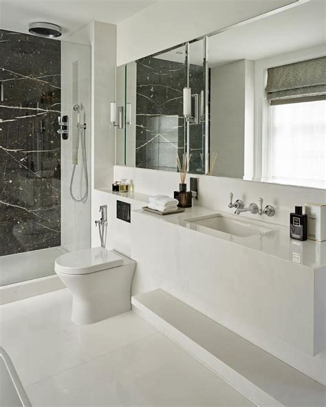 Given below are some design ideas for this marble tile in bathrooms: Master en-suite | Elegant white marble with book matched ...
