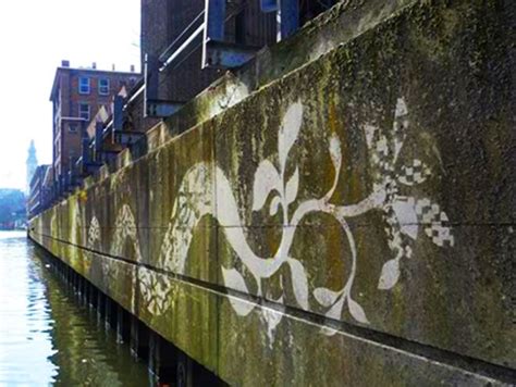 Street Artists Create Reverse Graffiti By Scrubbing Surfaces Clean