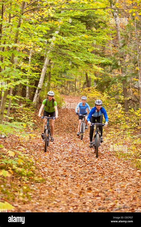 Women Mountain Biking On A Trail On Millstone Hill In Barre Vermont