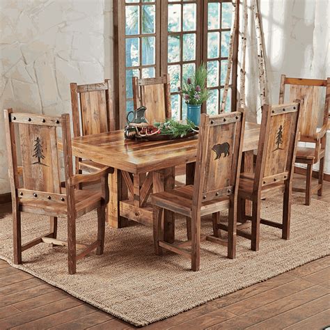 The cabriole front legs echo the balloon back, which features a darkened, rounded ridge. Reclaimed Wood Dining Chairs with Nature Carvings