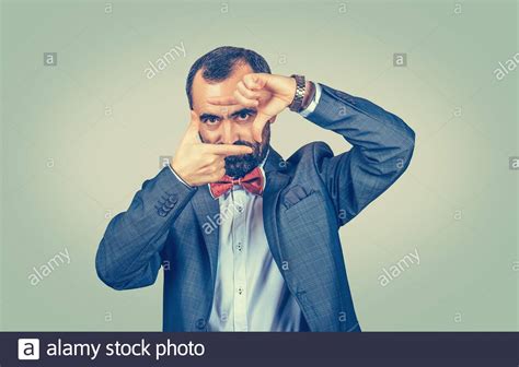Mature Middle Age Businessman Peeking Through His Fingers Hands