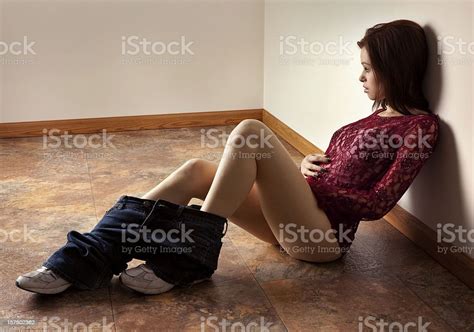 Beautiful Woman Alone With Her Thoughts Pants Down Around Ankles Stock