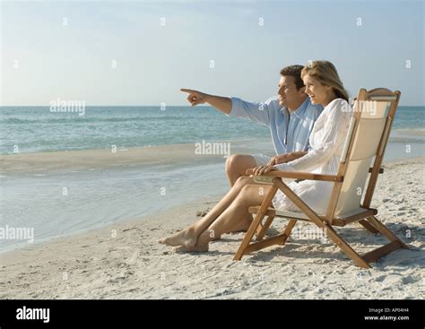 Couple Sitting In Deckchairs On The Beach Hi Res Stock Photography And