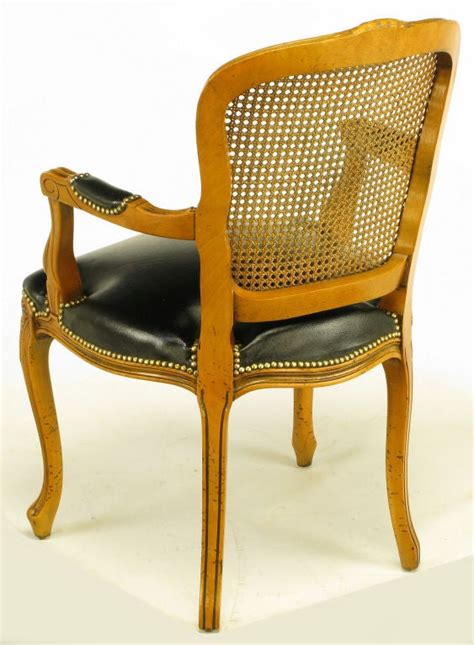 Create an inviting atmosphere with new living room chairs. Four Italian Carved Wood and Black Leather Arm Chairs at ...