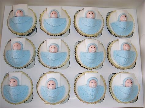 This baby shower cake idea sits on a slice of wood for a platter and is elevated atop a wooden box. More Baby Shower Cupcakes - All Things Cupcake