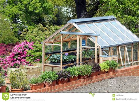 Greenhouse Or Hothouse Set In A Well Maintained Garden Stock Photo