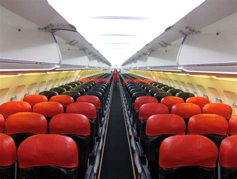 Aisle, window seat or even just sitting with your family for a small fee! The interior of an AirAsia Airbus A320-200 aircraft. | Air ...