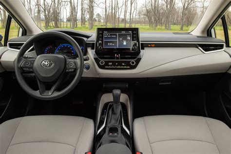 Se interior shown in blue/black premium sport seats with sport fabric inserts. 2020 Toyota Corolla Hybrid — The Prius Alternative - CarMoses