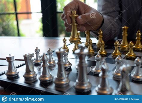 In chess, the king is never captured—the player loses as soon as their king is checkmated. Close-up Photos Of Checkmate Hands On A Chessboard During A Chess Game The Concept Of Business ...