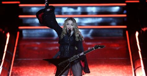 madonna pulls down 17 year old fan s top on stage reveals her breast cbs new york