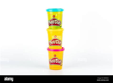 Play Doh Clay In A Yellow Small Container With Red Yellow And Blue