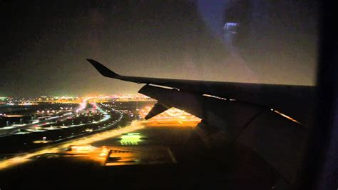 Nighttime Landing Aboard A Qatar Airways Airbus A350xwb At Doha Airport