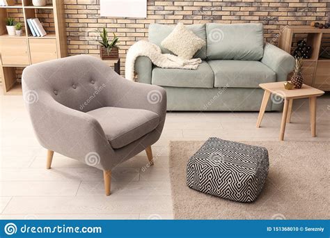 Choosing the right armchairs for your home can have a much bigger impact on the overall design than you think. Interior Of Modern Room With Sofa And Comfortable Armchair ...