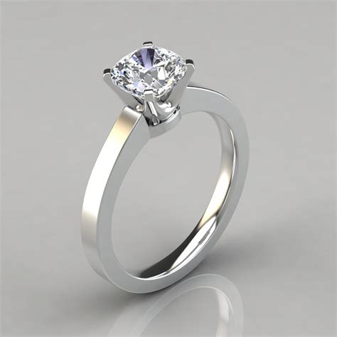 You can opt for a single solitaire style or choose a cushion cut halo engagement ring. Novo Cushion Cut Solitaire Engagement Ring - Forever Moissanite