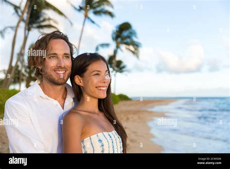 Couple Enjoying Hawaii Vacations On Hawaiian Beach Portrait Of Beautiful Asian Chinese Woman