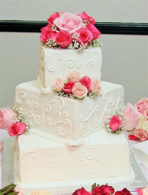 3 Tier Square Wedding Cake With Swirl Design And Pinklight Pink Roses