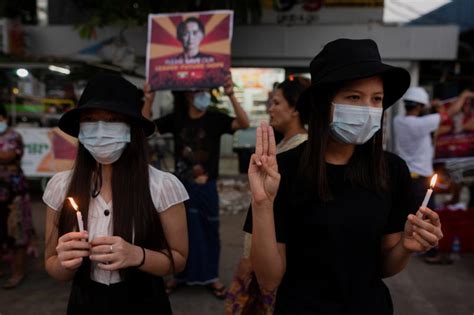 The masked instructor can be seen completing the workout routine as a convoy of suvs sped past behind her to uproot myanmar's leader aung san suu kyi. Myanmar coup opponents call for new show of force