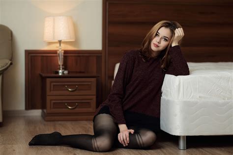 Online Crop Woman Wearing Brown Sweater And Black Stockings Leaning On White Bed Hd Wallpaper