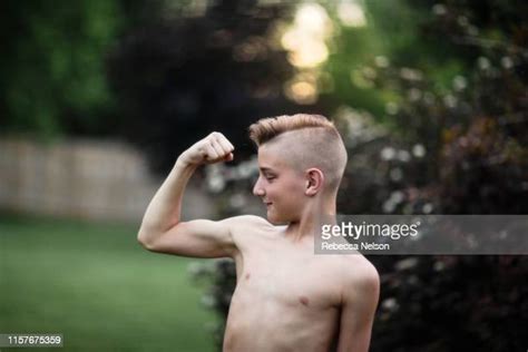 Teenage Boy Flexing Bildbanksfoton Och Bilder Getty Images