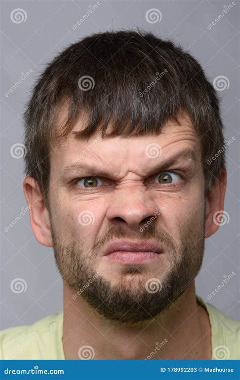 Close Up Portrait Of A Man Funny Frowning Eyebrow Of European