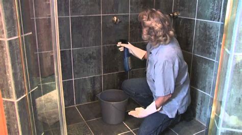 One way to clean your showerhead is by taking it off the pipe and soaking it in vinegar. How to Clean Shower Stall Tile - YouTube